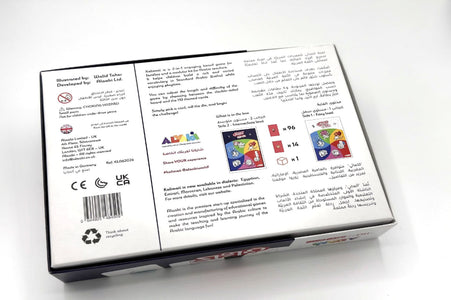 The back of a game box photographed on a white background, showing printed rules text, barcodes, certification marks, and small card illustrations. No person, animal, or real environment is present, so this is Product/Packaging.